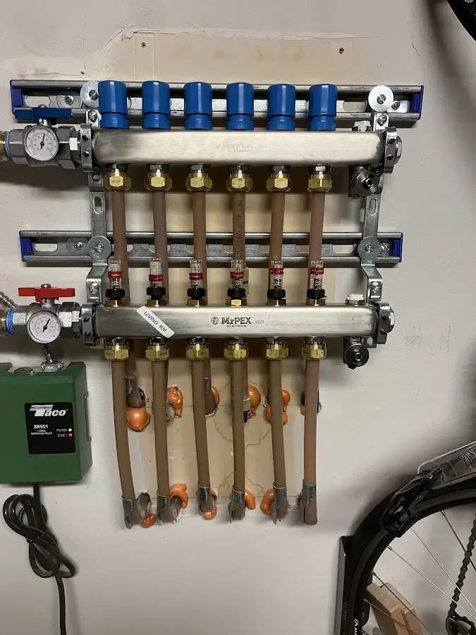 Plumber performing Water Heater Repair at a residential property in Scituate